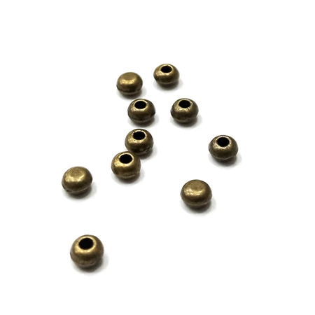 Fém köztes félig fúrt lencse 4mm antikréz 10db/csomag